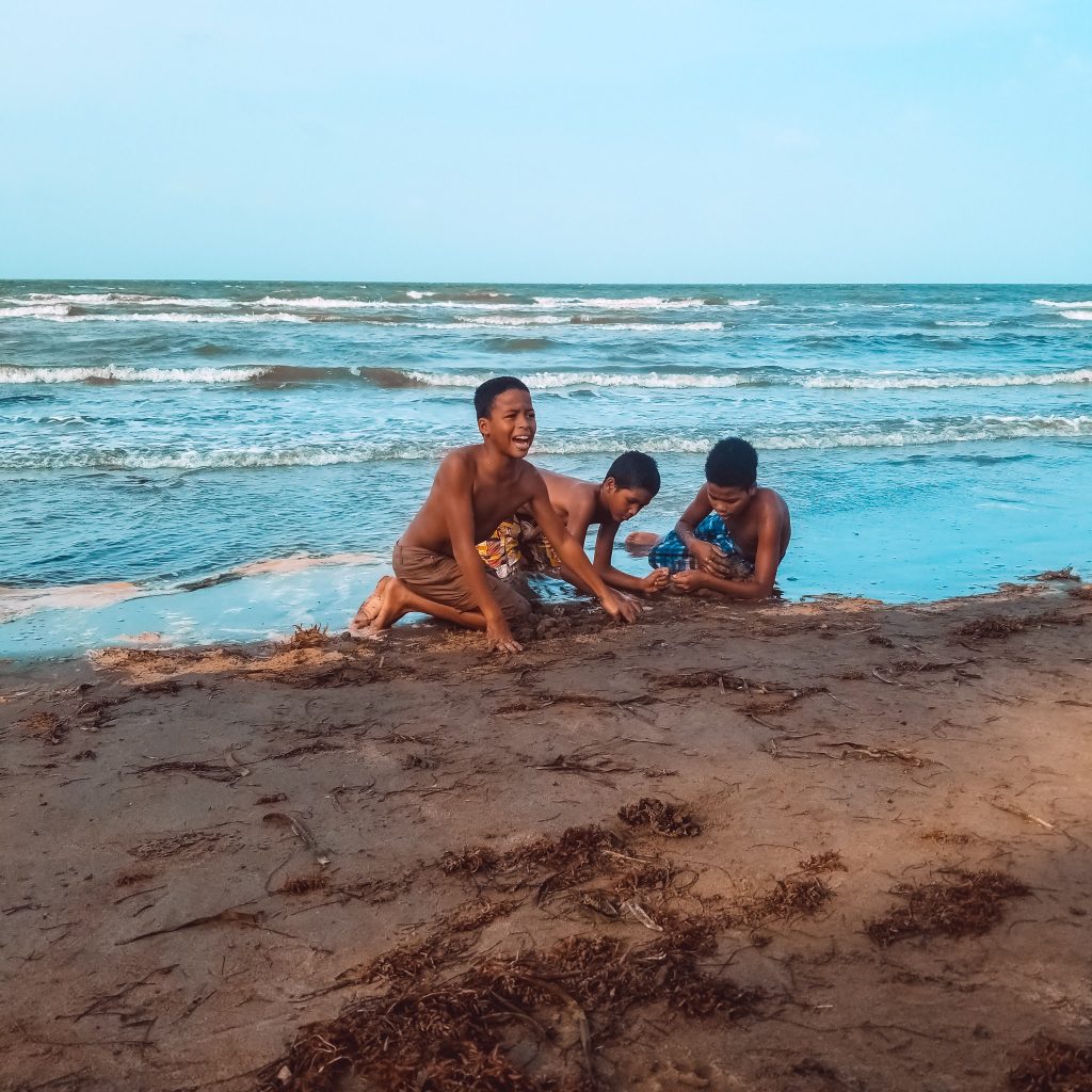 children playing by the beach